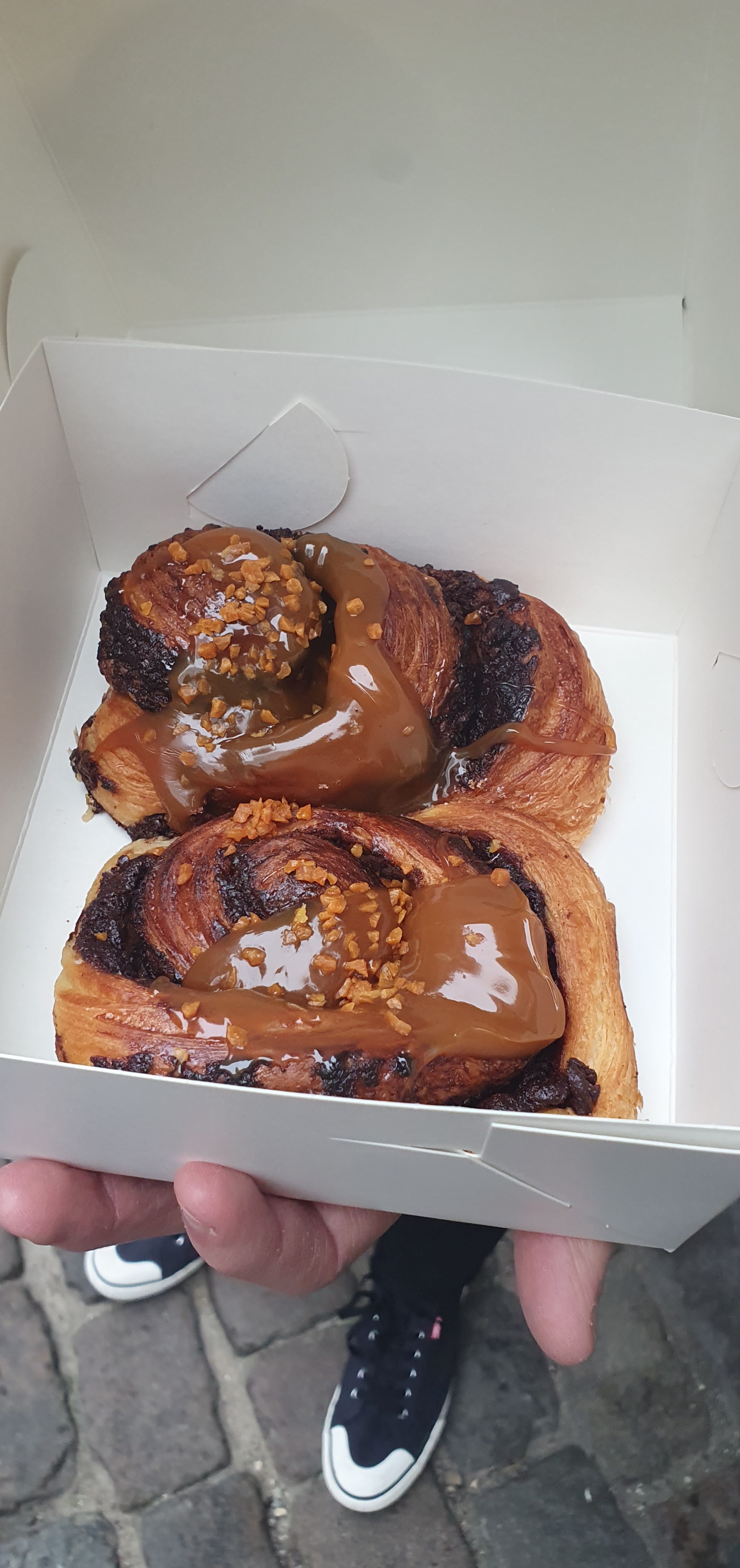 Danish pastry covered in chocolate and topped with Salted Caramel